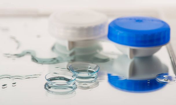 Container for contact lenses and reflection - 写真・画像