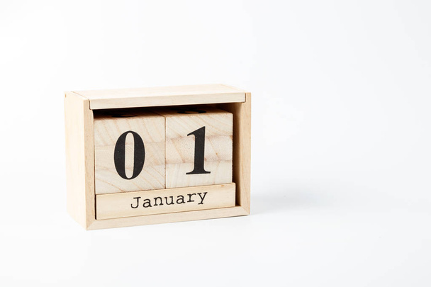 Wooden calendar January 01 on a white background close up - Foto, immagini