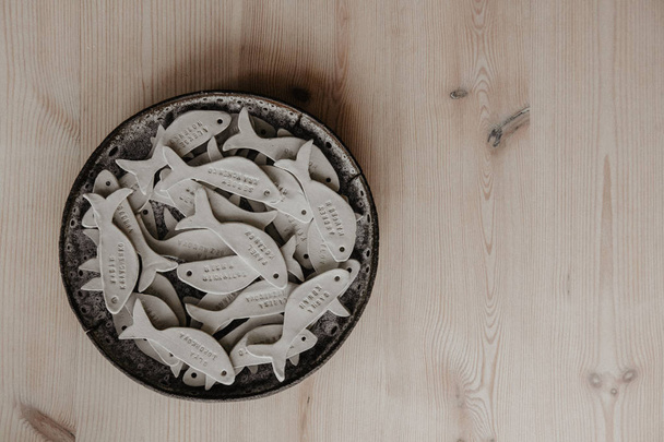 Decorative clay plates, on a wood background with copy space. - Φωτογραφία, εικόνα