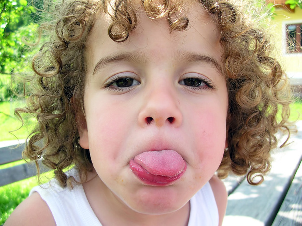 Little boy sticking his tongue out - Photo, Image