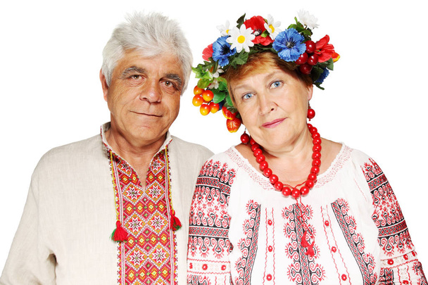 Mature couple in Ukrainian costumes on a white background - Photo, Image