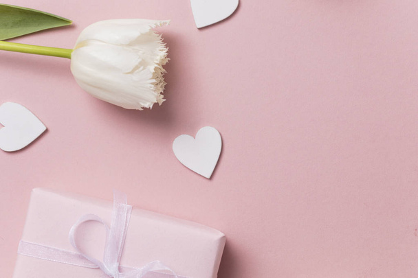 Pink celebration background, flowers, hearts and gift. - 写真・画像
