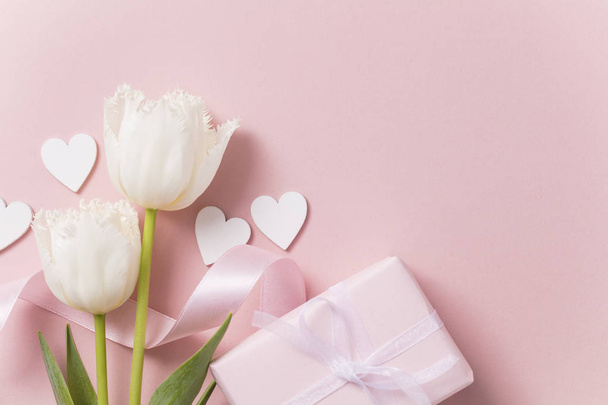 Pink celebration background, flowers, hearts and gift. - Foto, imagen