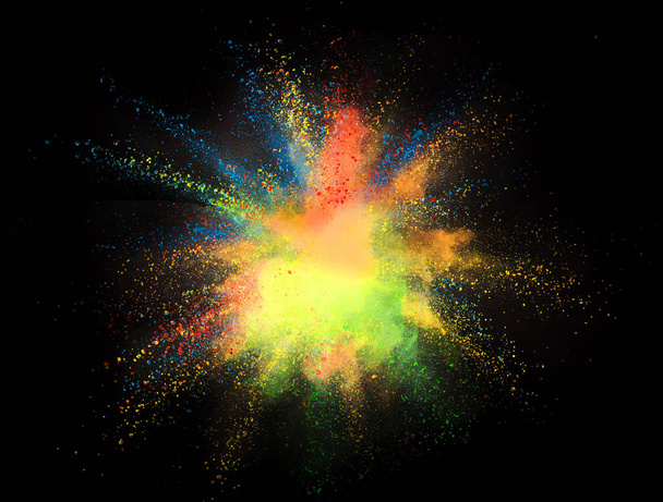Explosion of colored powder isolated on black background. Abstract colored background - Foto, imagen