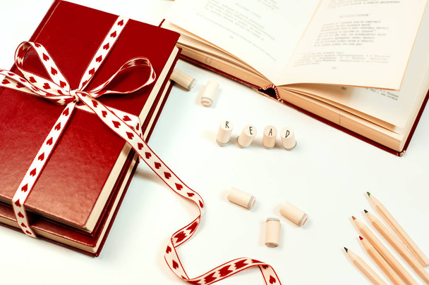 Valentines day background. Stack of books with ribbon - Zdjęcie, obraz