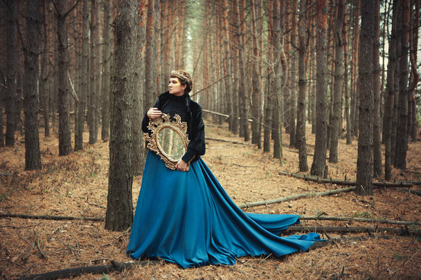 Model wearing blue skirt is posing as a queen - Photo, Image