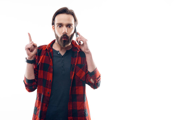 Bearded Man Have Idea While Talking on Phone - Valokuva, kuva