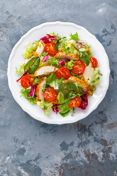 Fresh vegetable salad with grilled chicken meat, top view - Fotografie, Obrázek