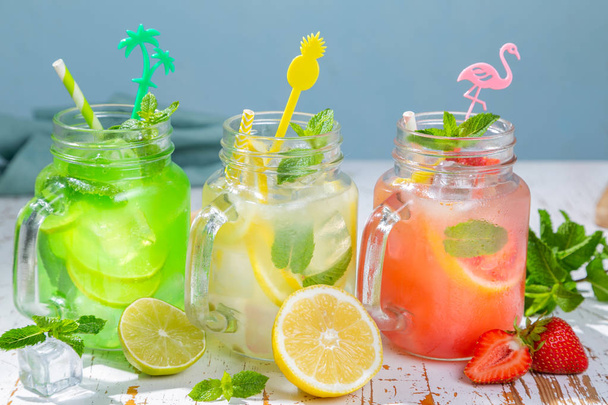 Selection of summer lemonades in glass jars - Photo, image