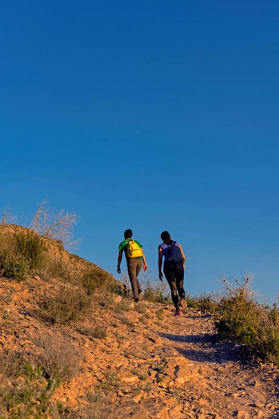 Groups of people hiking in spanish mountains. - Фото, зображення
