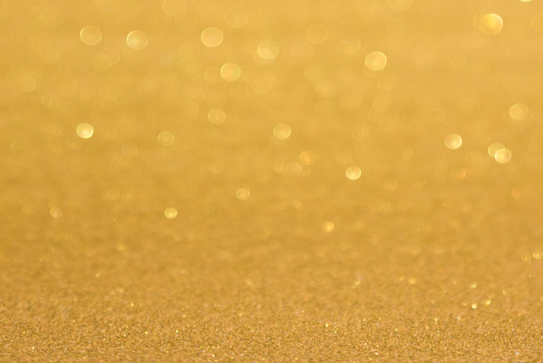 Golden defocused flickering lights for text and background - Foto, imagen