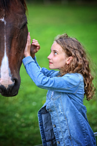 girl on ranch with horse - 写真・画像