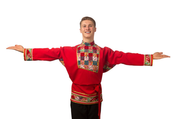 Attractive russian guy dancing in folk costume isolated on white background - Valokuva, kuva