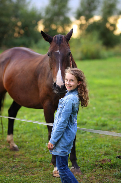 young girl on ranch with horses - Foto, Bild