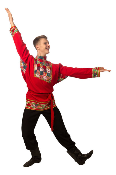 Attractive russian guy dancing in folk costume isolated on white background - Foto, immagini