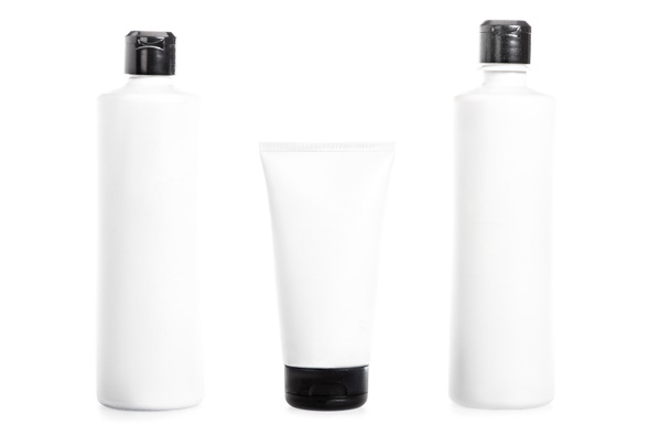 Studio shot of plastic bottles and cream tube isolated on white  - Foto, Imagem