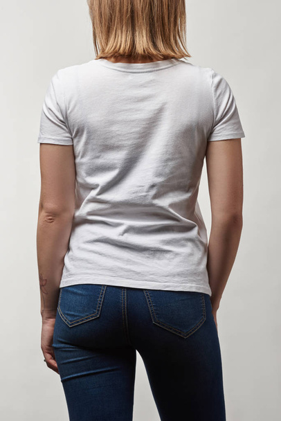 back view of young woman in white cotton t-shirt with copy space isolated on white - Φωτογραφία, εικόνα