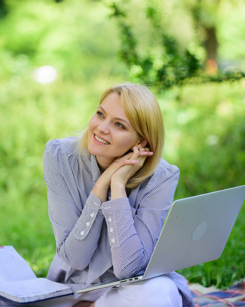 Woman with laptop sit on rug grass meadow. Online freelance career concept. Pleasant occupation. Guide starting freelance career. Business lady freelance work outdoors. Become successful freelancer - Photo, image