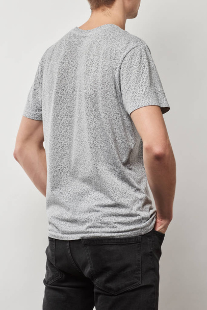 back view of man in t-shirt with copy space isolated on grey - Photo, Image