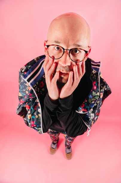 high angle view of young man in fashionable clothes on pink background - 写真・画像
