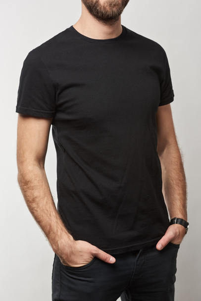 cropped view of man in basic black t-shirt with copy space isolated on white - Photo, Image