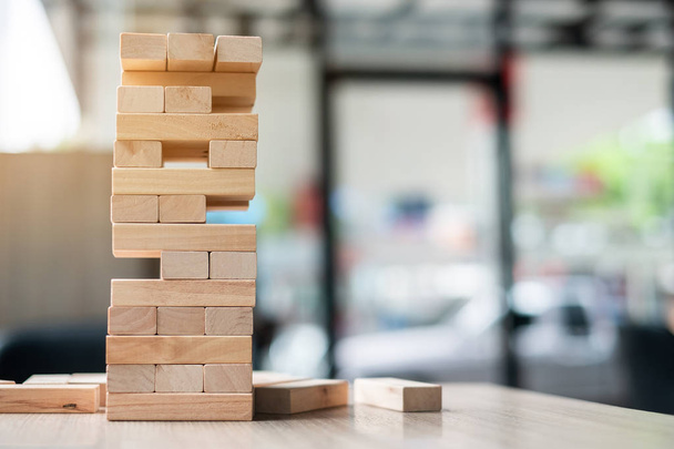 wooden block tower on office background. Business planning, Risk Management, Solution and strategy Concepts - Foto, Imagem