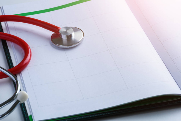 stethoscope and glasses on calendar book. Doctor Appointments concepts - Fotó, kép