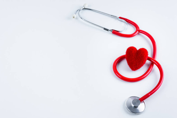 Red heart and stethoscope on white table with copy space - Fotoğraf, Görsel