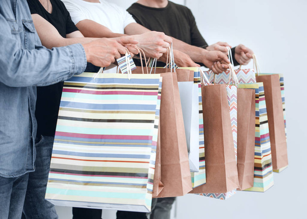 a group of people holds a gift bag. - Foto, immagini
