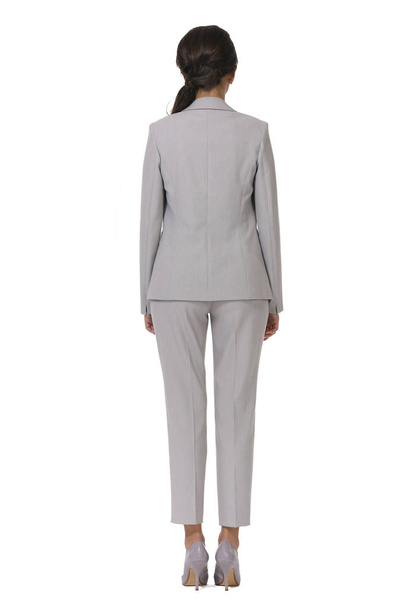kaukázusi nő cégvezető pózol kockás nadrág öltöny magas sarkú cipő teljes test hossza elszigetelt fehér hátsó nézet - Fotó, kép
