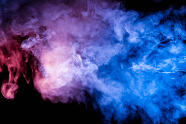 Egy színes fényreklámok füst mintát egy sötét háttér előtt egy átmenet a kék lila színű, fehér részecskék a csillag por.. - Fotó, kép
