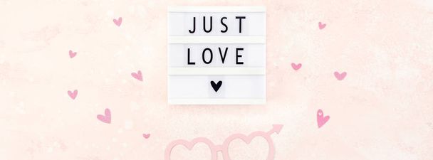 Creative Valentine Day romantic composition flat lay top view love holiday celebration with red heart lightbox pink background copy space Template greeting card text design social media blogs - Photo, Image