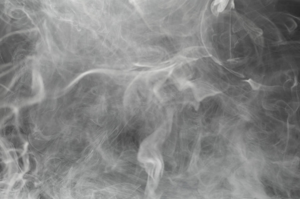 humo denso sobre fondo negro
 - Foto, Imagen