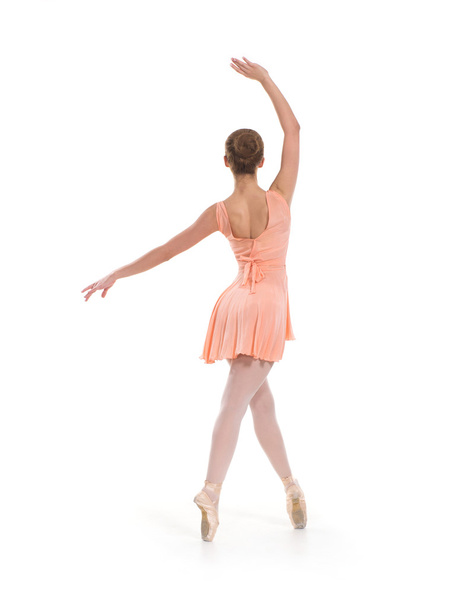 白い背景の上の光のドレスの若いバレエ ダンサー - 写真・画像