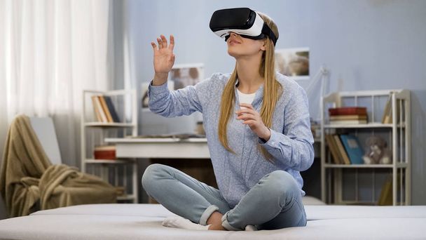 College girl having fun wearing virtual reality glasses, modern technology - Zdjęcie, obraz