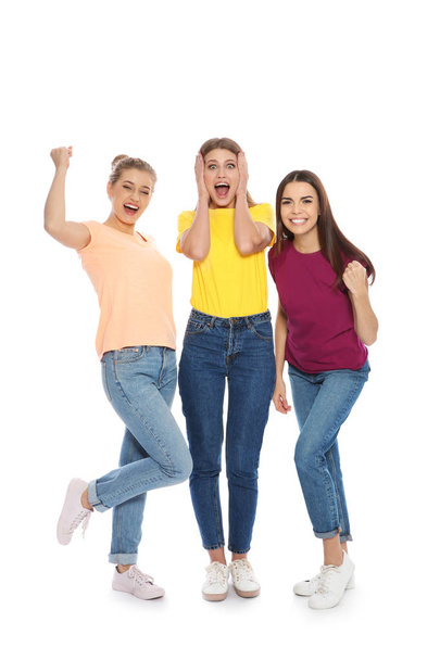 Young women celebrating victory on white background - Foto, afbeelding