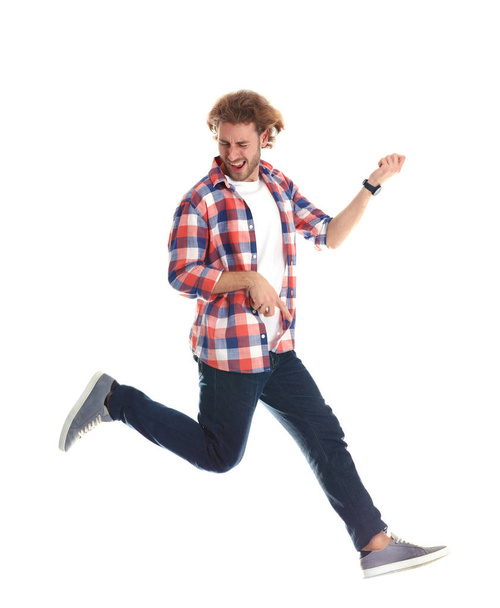 Young man playing air guitar on white background - Zdjęcie, obraz