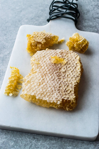 Fresh Honeycomb Slices with Honey on Marble Board. Organic Food. - Photo, image