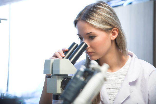 researcher with microscope - Photo, Image