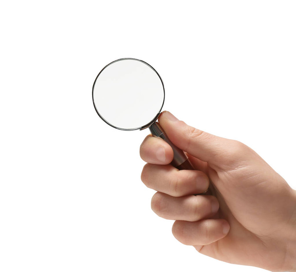 Woman holding magnifying glass on white background, closeup - Фото, изображение