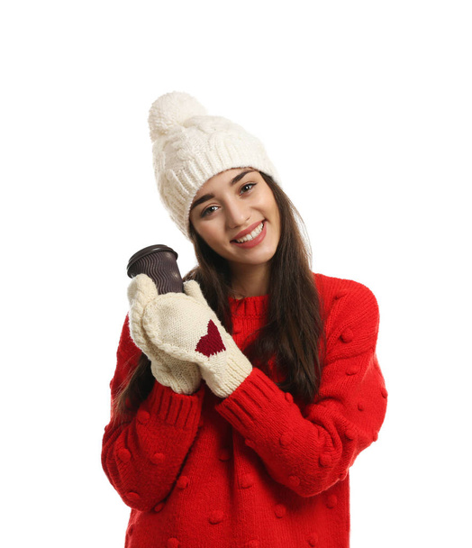 Young woman with cup of hot coffee on white background. Winter season - Foto, Bild