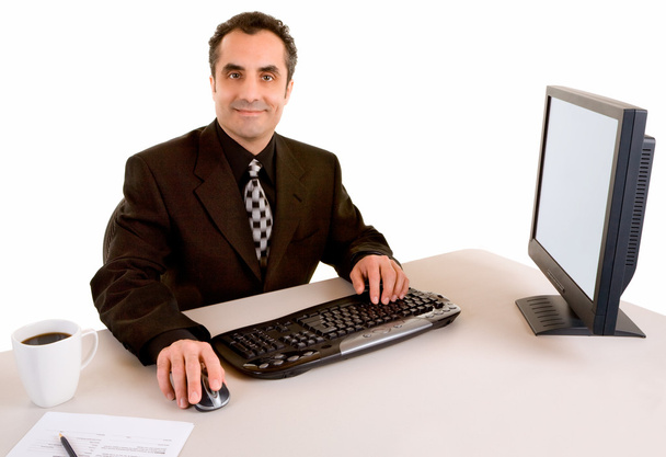 mosolygó üzletember az íróasztalánál dolgozik - Fotó, kép