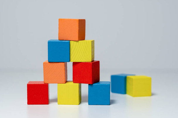 Building from wooden colourful childrens blocks - 写真・画像