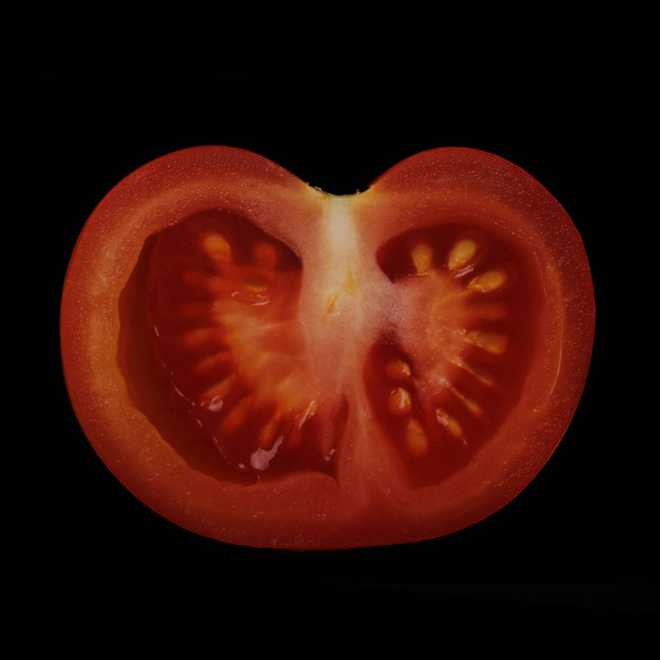 Closeup of tomato on dark background - Photo, Image