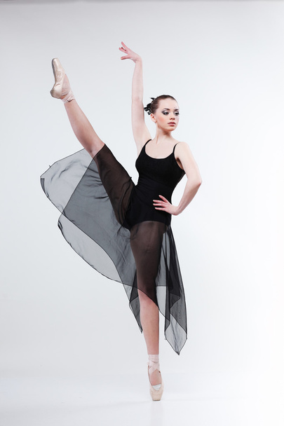 Beautiful ballet-dancer, modern style dancer posing on studio background - 写真・画像