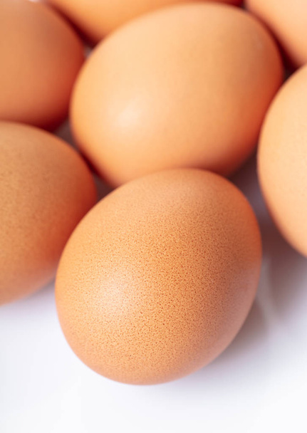 food background from brown chicken eggs closeup - 写真・画像