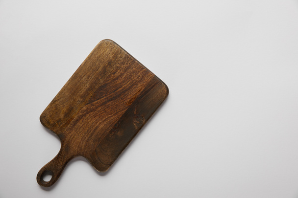 top view of wooden cutting board on grey background - Φωτογραφία, εικόνα
