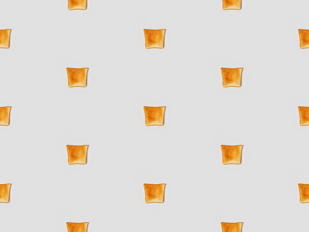  collage of grilled crispy toasts on grey background, seamless background pattern - Fotografie, Obrázek