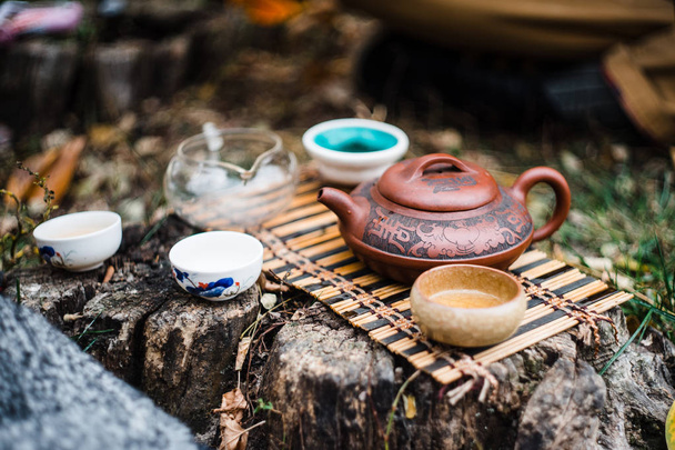 Tiny tea ceremony outdoor  on the ground in daylight - Fotoğraf, Görsel