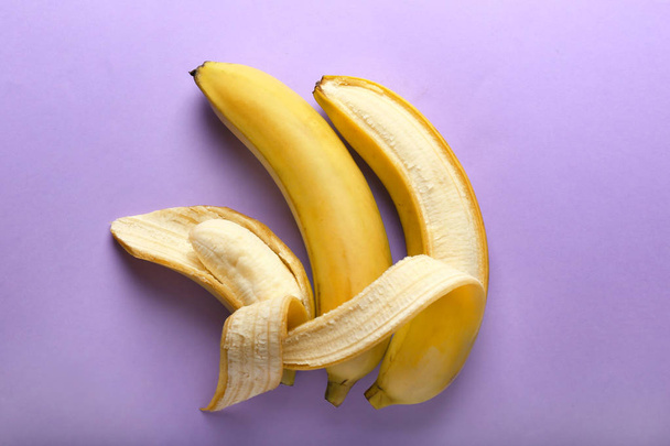 Creative composition with tasty fresh bananas on color background. Concept of happy family - Foto, immagini